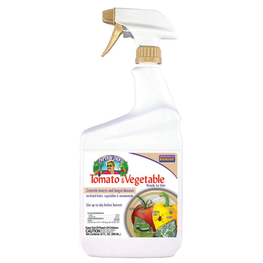 A white spray bottle labeled Captain Jack's® Tomato & Vegetable 3-in-1 Ready to Use, featuring images of tomatoes, peppers, and squash. Controls insects and fungal diseases on fruits and vegetables - Photo Courtesy of Captain Jacks®