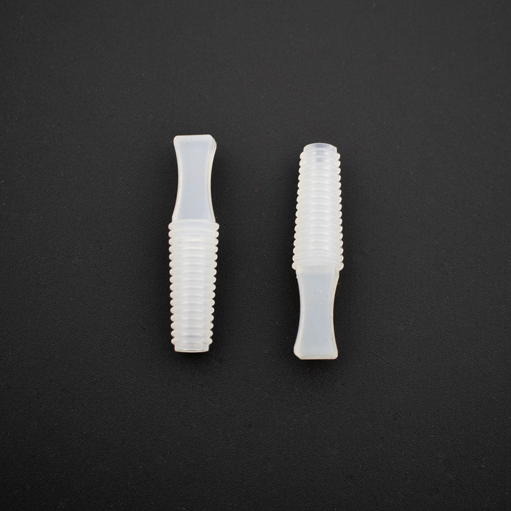 White plastic plugs for the Weekender® Basket Plug on a black background - Photo Courtesy of Eckert's Greenhouse