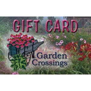 Photo of garden scene with the text "gift card" and "garden crossings" superimposed on it by a graphic of a cart of flowers