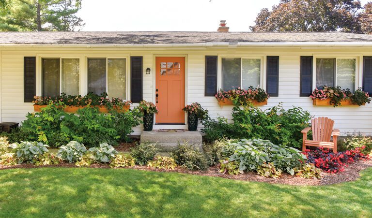 Front yard with shade plants making a border and in pots