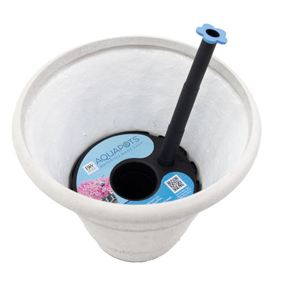 White flower pot with an AquaPots® Lite Insert inside, featuring a blue label and a black watering tube with a blue flower-shaped cap. This insert offers easy, self-watering plant care.
